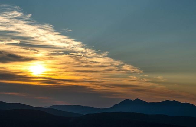 The sunrise over the Bigelow Preserve mountians